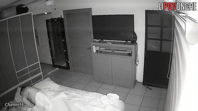 An aroused husband tries to pull the nightgown off his sleeping wife