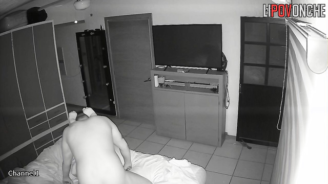 An aroused husband tries to pull the nightgown off his sleeping wife