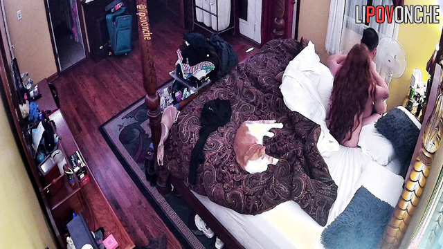 A naked redheaded wife gently gives her husband a back massage