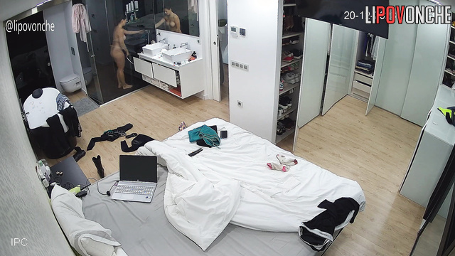 A hidden camera captured a sexy girl undressing completely before taking a shower