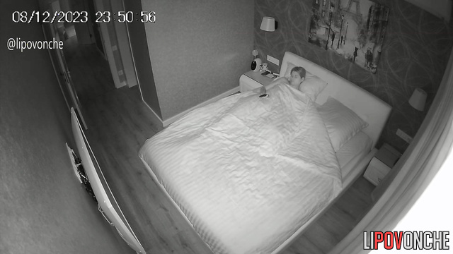 A skinny brunette admires her seductive body with interest before going to bed