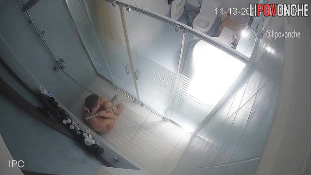 A husband secretly filmed his wife looking at her breasts and taking a shower