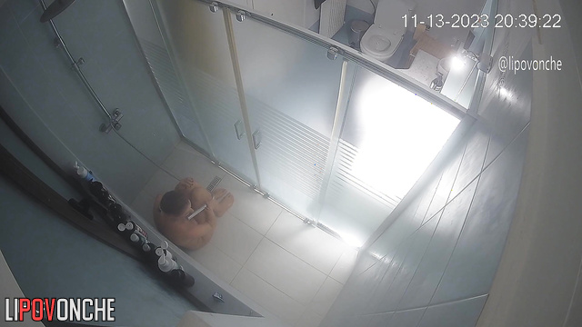 A husband secretly filmed his wife looking at her breasts and taking a shower