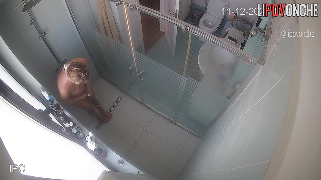 The beauty seductively slips out of her robe and takes a shower