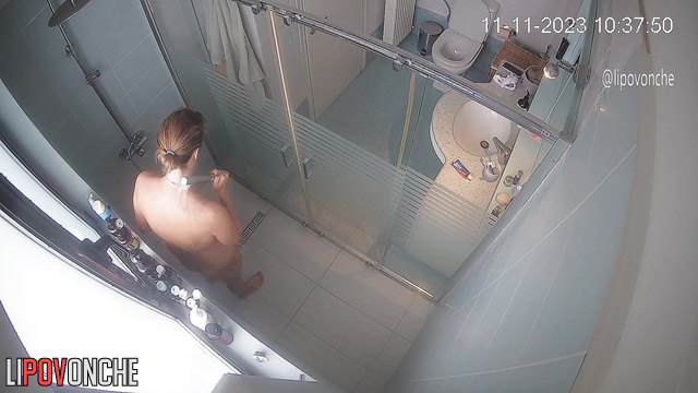 The naked mommy got bored sitting on the toilet, so she went to take a shower