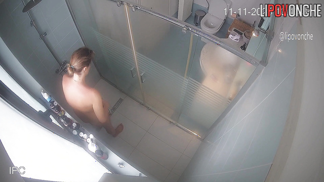 The naked mommy got bored sitting on the toilet, so she went to take a shower