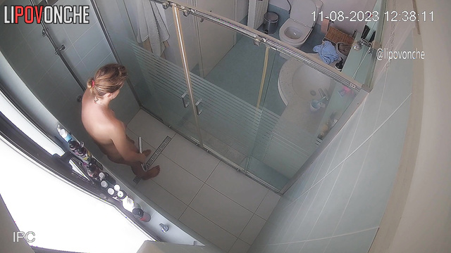 A tired mommy washes her sexy naked body under jets of water in the shower