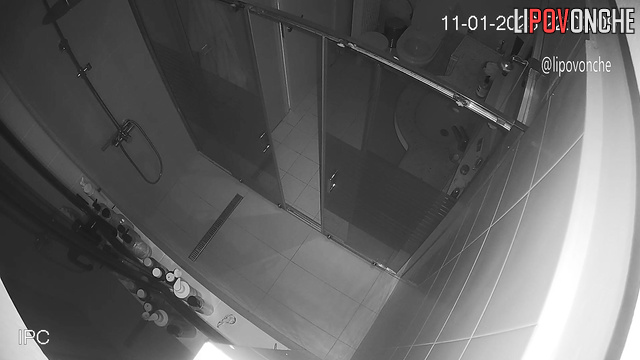 A sleepy woman, completely naked, walks into the toilet