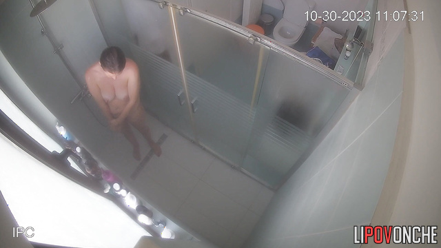 A slender mommy undresses while sitting right on the toilet