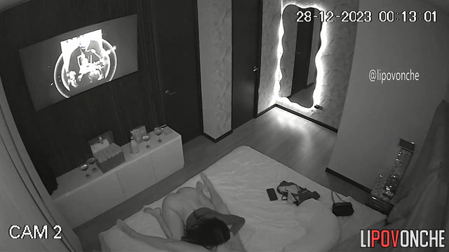 Two gorgeous lesbians are drinking wine in bed and having hot sex