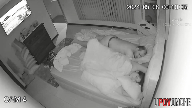 A busty girl plays with her hot pussy while her balding husband sleeps