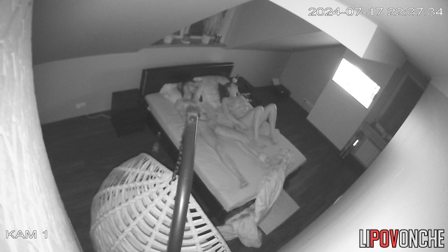 A naked brunette gently strokes a man's big cock and gives him a blowjob