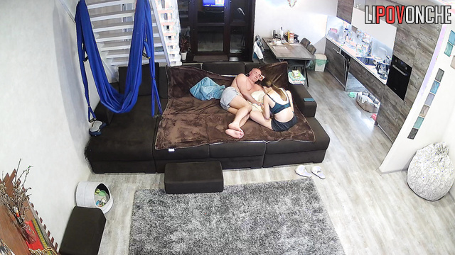 The husband tries to snuggle up to his skinny wife as she gives him a manicure