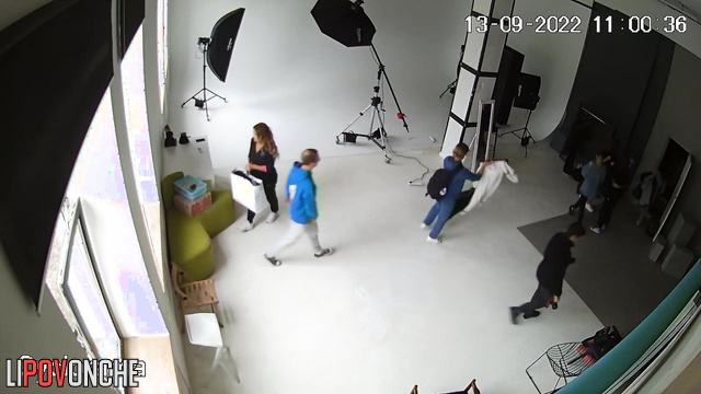 A hidden camera captured a photo shoot of a half-naked pregnant beauty