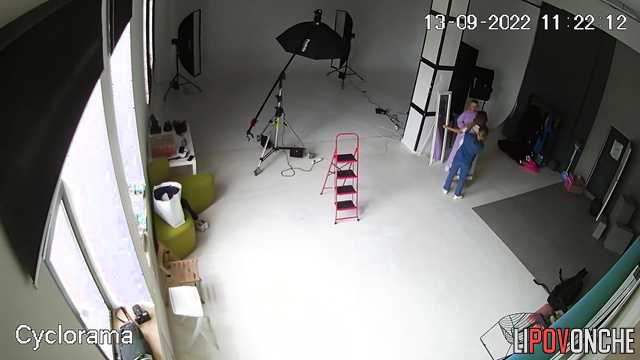 A hidden camera captured a photo shoot of a half-naked pregnant beauty