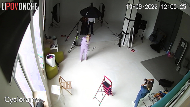 A hidden camera captured a photo shoot of a half-naked pregnant beauty
