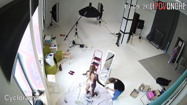 A hidden camera captured a photo shoot of a half-naked pregnant beauty