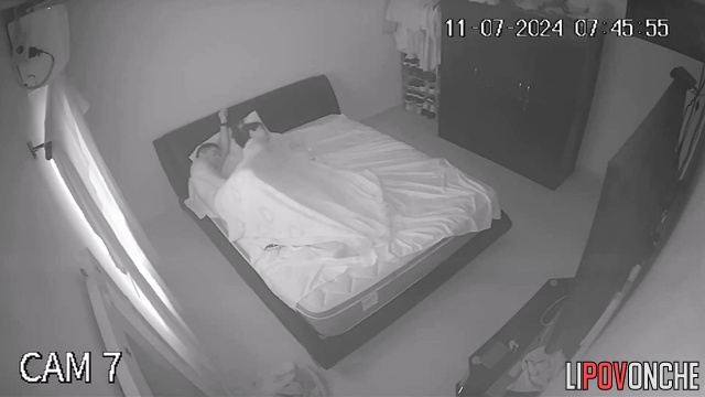 An aroused husband tries to press his cock against his sleeping wife's ass