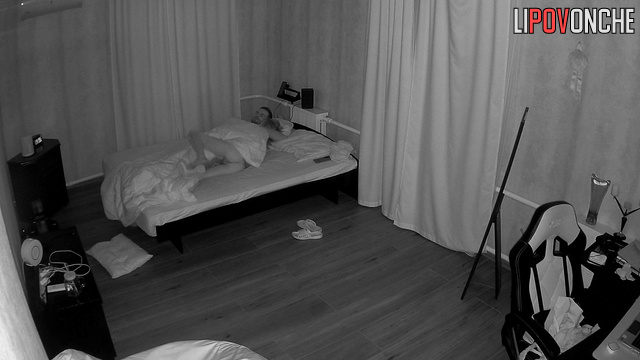A skinny girl sleeping in bed showed her toned, naked butt to the camera