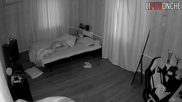 A skinny girl sleeping in bed showed her toned, naked butt to the camera