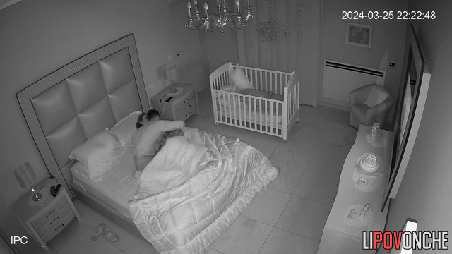 Late at night, sleepy wife manually brings her aroused husband to orgasm