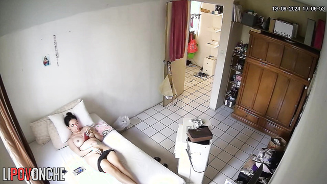 Brunette watching something interesting and touching herself