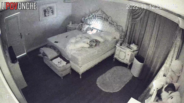 Close relatives are watching tv together (in the cozy bedroom)