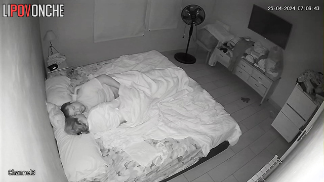 Spouses teasing each other under the blanket, look