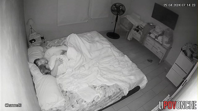 Spouses teasing each other under the blanket, look