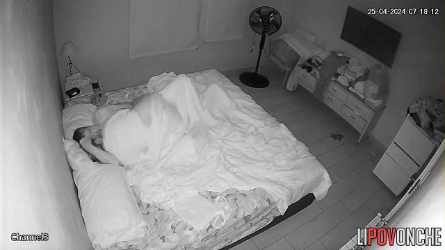 Spouses teasing each other under the blanket, look