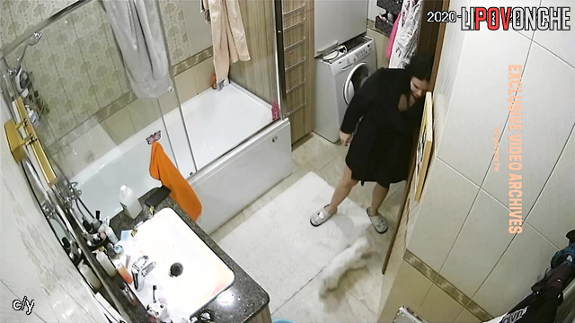 Brunette played with her dog and then went about her business