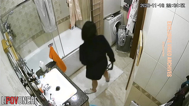 Brunette played with her dog and then went about her business