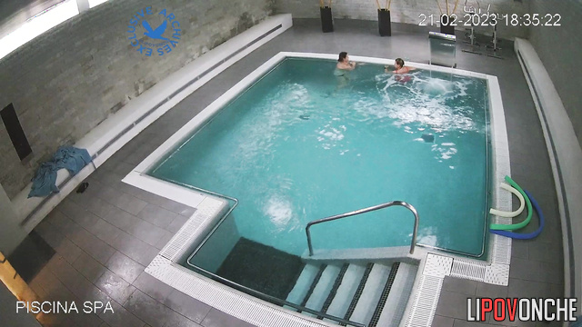 Women chatting and swimming in the public pool, look