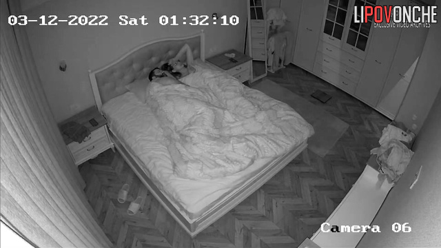 A bearded man wakes up and plays with his sleeping wife's sexy breasts
