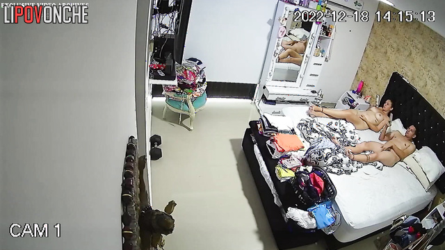 Spouses relaxing completely naked on the bed, spy cam