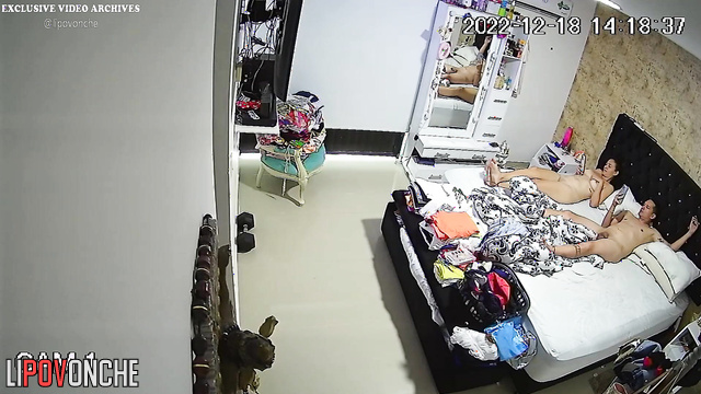 Spouses relaxing completely naked on the bed, spy cam