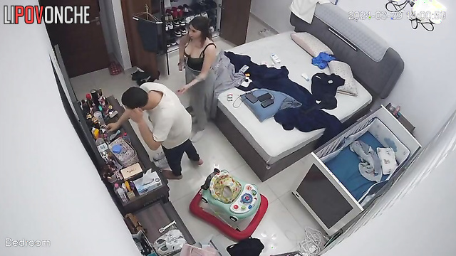 He was helping his wife button her dress, spy camera