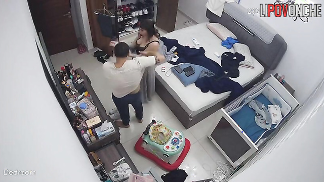 He was helping his wife button her dress, spy camera
