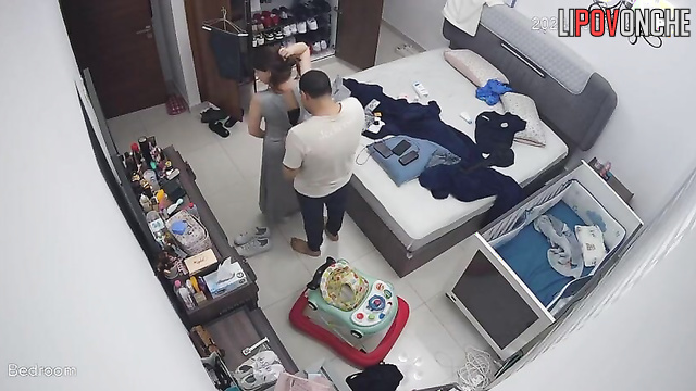 He was helping his wife button her dress, spy camera