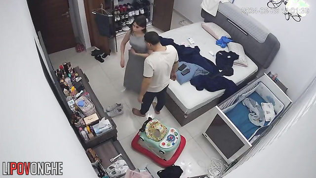 He was helping his wife button her dress, spy camera