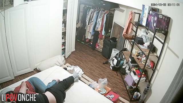 Сouple having fun in bed before going to sleep without even undressing