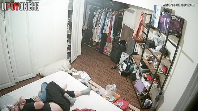 Сouple having fun in bed before going to sleep without even undressing
