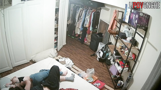 Сouple having fun in bed before going to sleep without even undressing