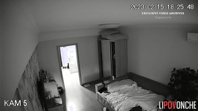 Couple kissing gently in the bedroom (she is in underwear)